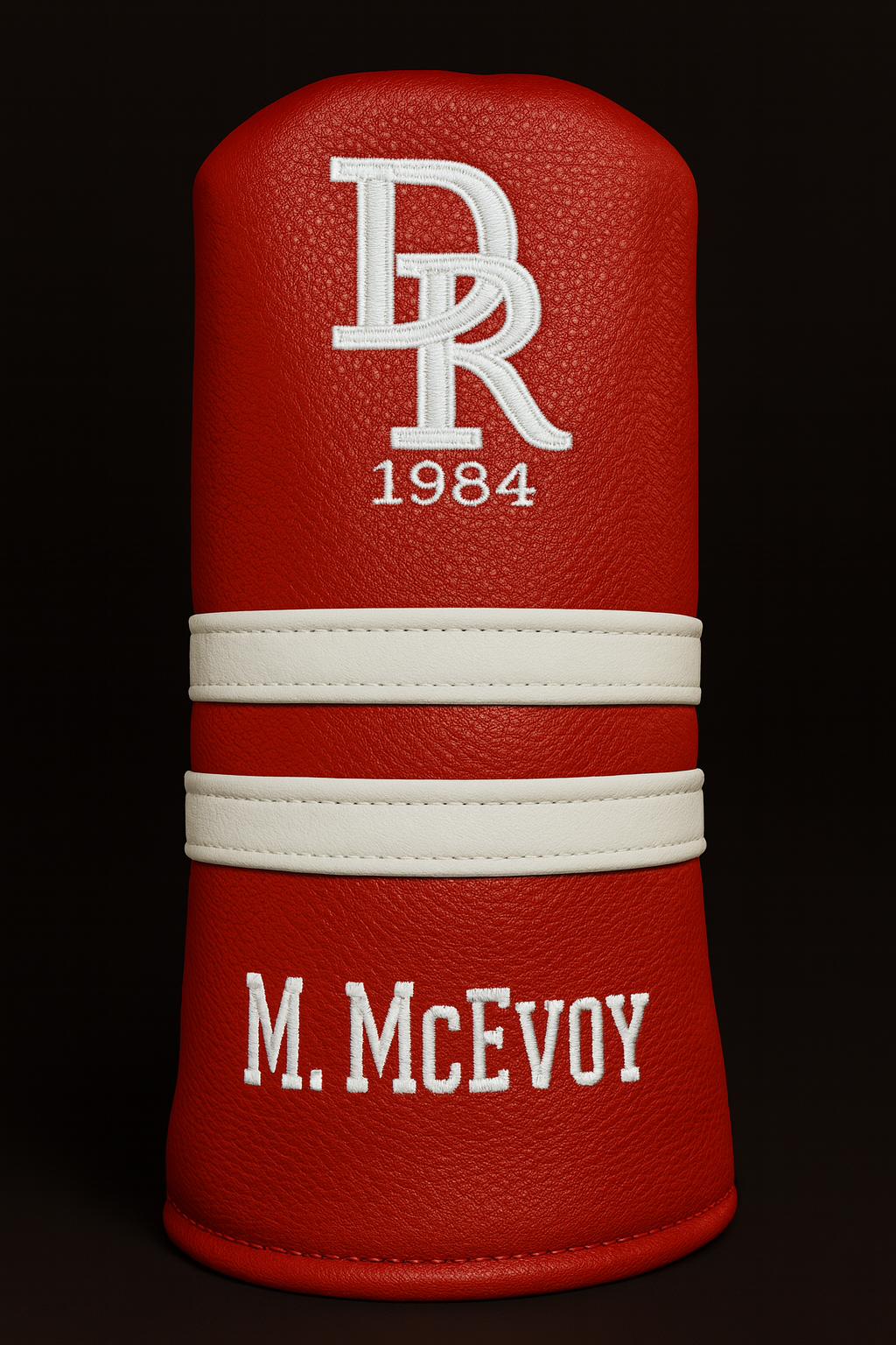Red leather product with white branding on a black background
