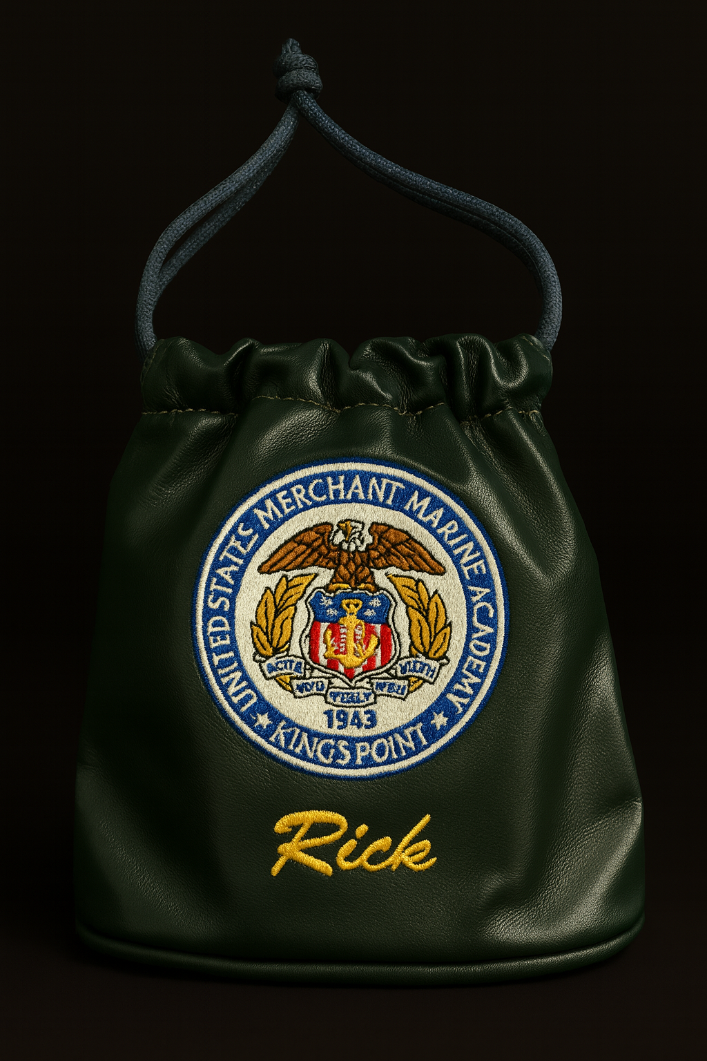 Green drawstring bag with embroidered emblem and name 'Rick' on a black background
