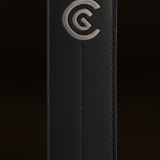 Black leather alignment stick cover with a logo on a black background