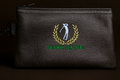 Black leather pouch with embroidered logo and 'Fairway Leathers' text on a dark background