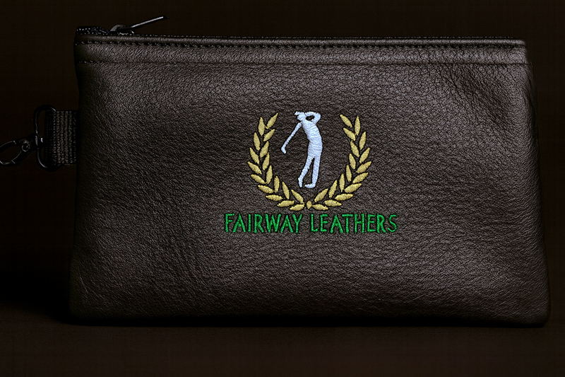 Black leather pouch with embroidered logo and 'Fairway Leathers' text on a dark background